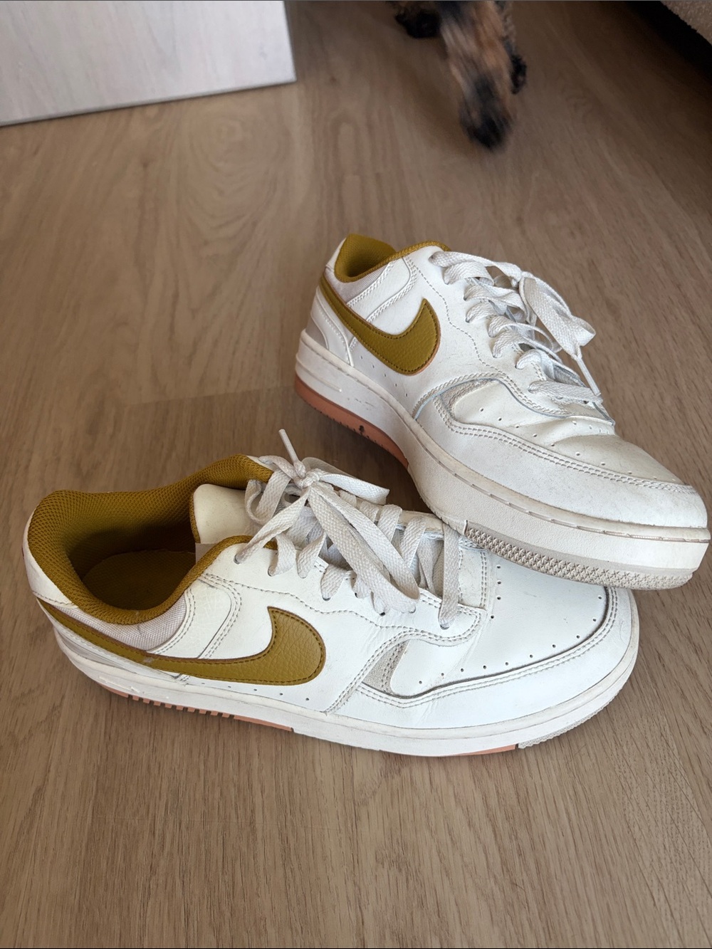 Nike White Low-Top Sneakers with Mustard Swoosh